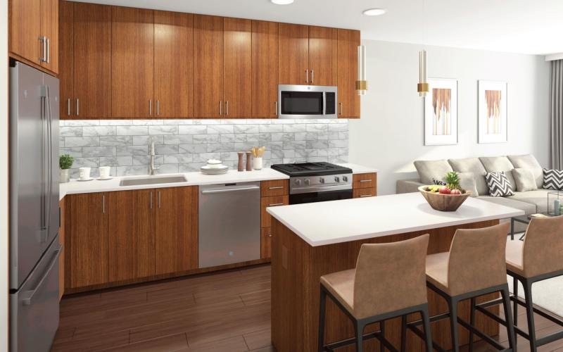 a kitchen with white cabinets and natural lighting